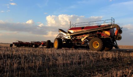 A tractor seeding a field.