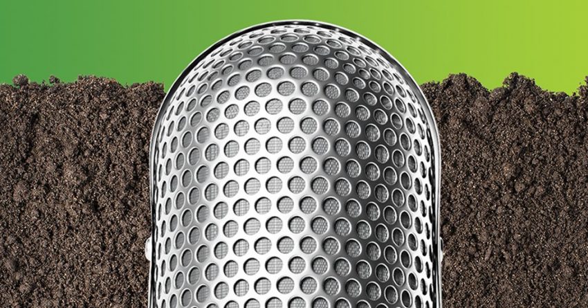 The Dirt Podkast microphone on a dirt background.