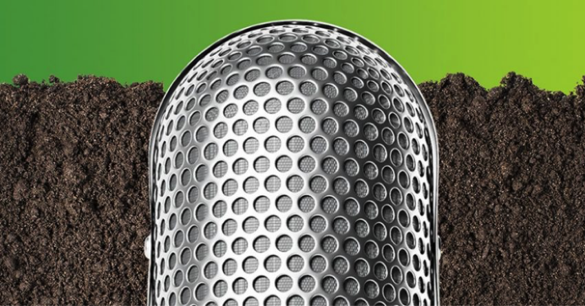 The Dirt Podcast microphone with a background of soil.