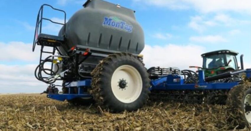 A MonTag tiller rolling through a field of harvested corn.