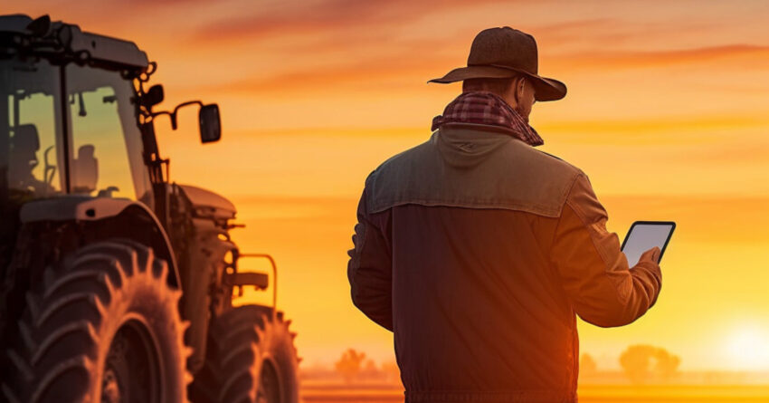 Farmer using a tablet in the field. Modern agriculture and technology