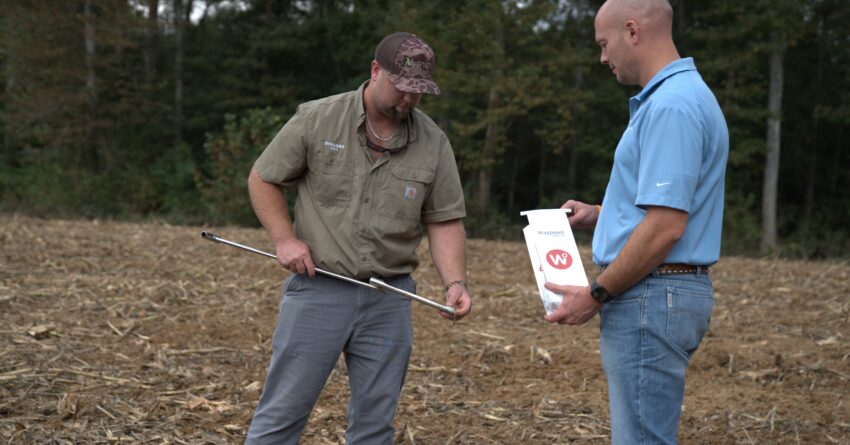 Pulling a soil sample for biological soil testing.